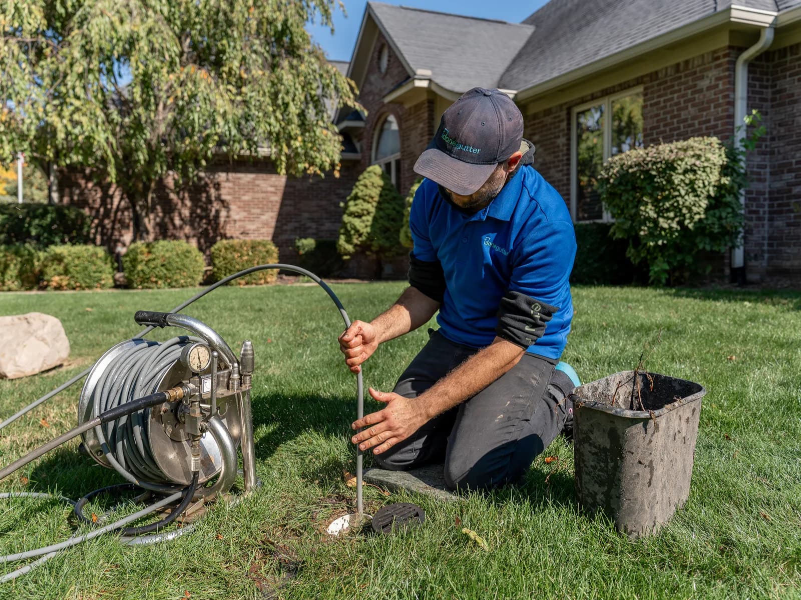 Active hydrojetting of a horizontal downspout extension